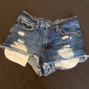 Blue ripped jean shorts.